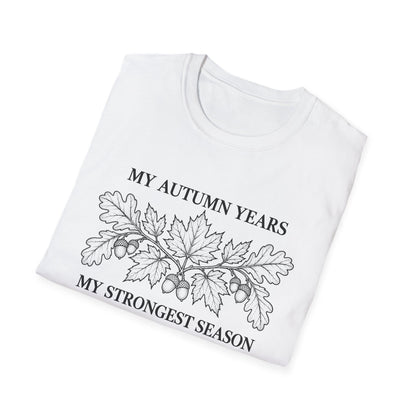 Folded white t-shirt printed with "MY AUTUMN YEARS, MY STRONGEST SEASON" in black, with oak leaves and acorns