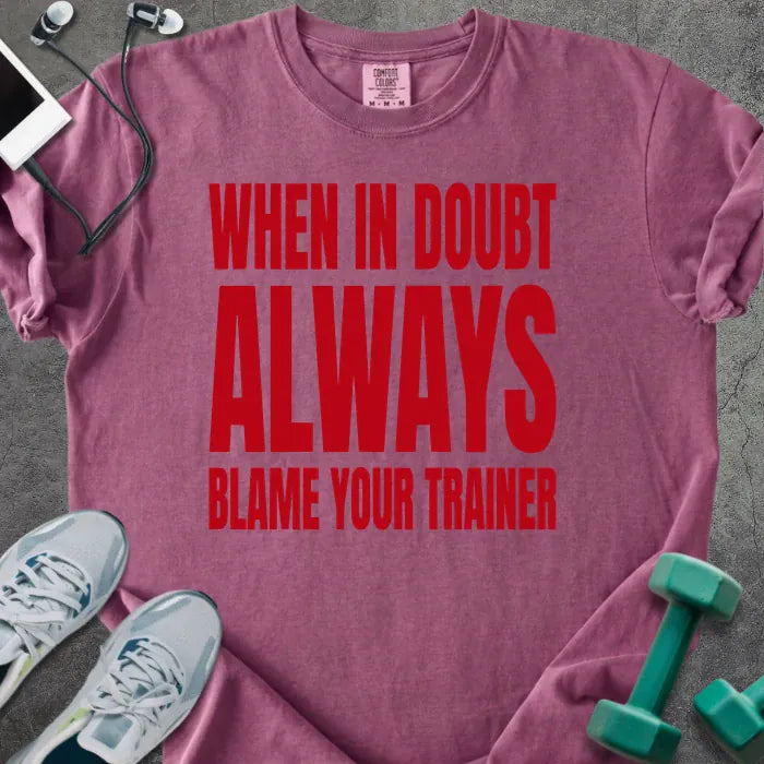 Berry t-shirt printed with "When in Doubt Always Blame Your Trainer" in red
