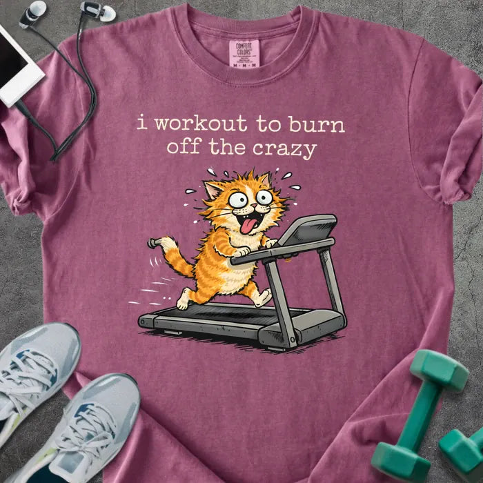Berry t-shirt printed with "i workout to burn off the crazy" in orange, with a cat running on a treadmill