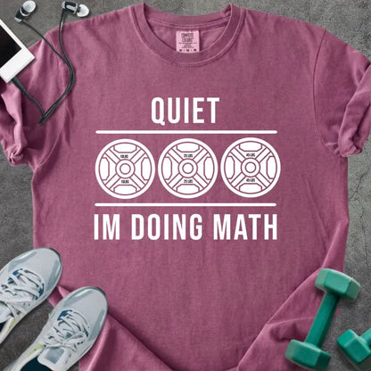 Berry t-shirt printed with "Quiet Im Doing Math" in white, with three weight plate graphics