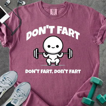 Berry t-shirt printed with "Don't Fart Don't Fart, Don't Fart" in white, with a smiling stick figure lifting weights
