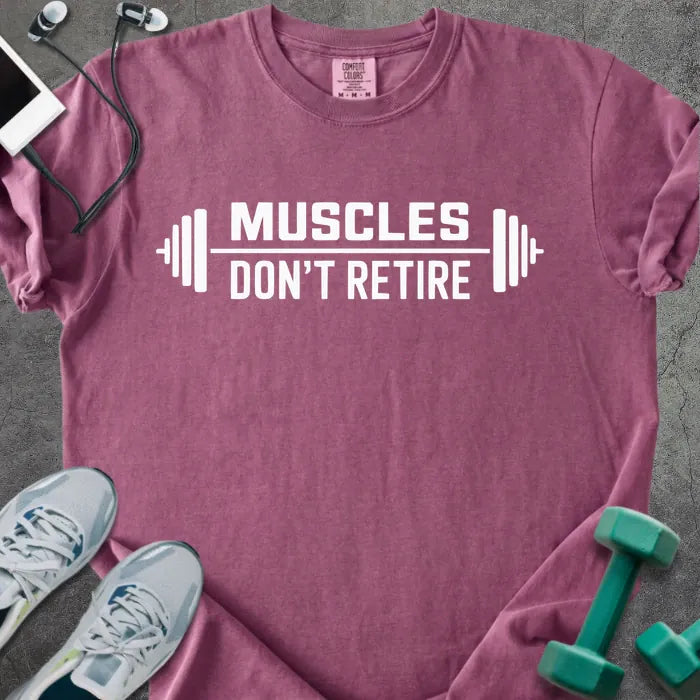 Berry t-shirt printed with "Muscles Don't Retire" in white, with a barbell