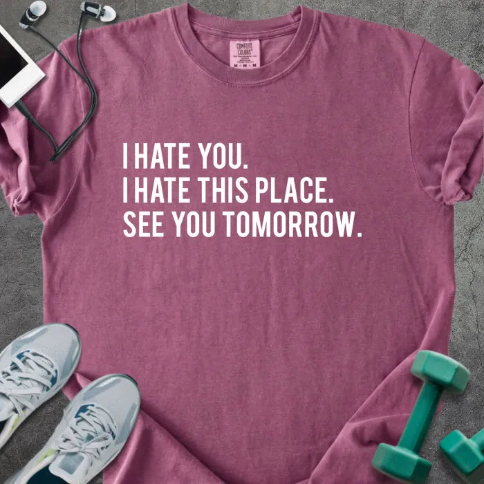 Berry t-shirt printed with "I Hate You. I Hate This Place. See You Tomorrow." in white