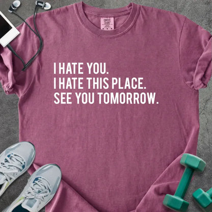 Berry t-shirt printed with "I Hate You. I Hate This Place. See You Tomorrow." in white