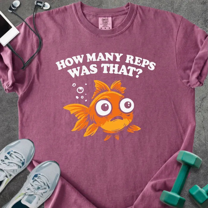 Berry t-shirt printed with "How Many Reps Was That?", with an illustration of a wide-eyed goldfish and bubbles