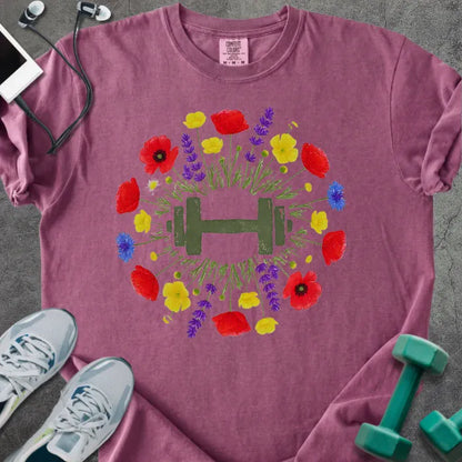 Berry t-shirt with colorful wildflowers and dumbbells in circular arrangement in red, yellow, purple, blue, and green