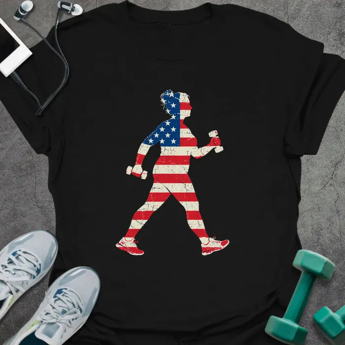 Black t-shirt printed with a woman power walking with hand weights, filled with a distressed American flag
