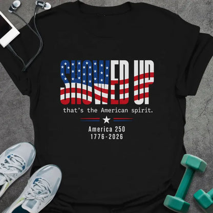 Black t-shirt printed with "FIND UP that's the American spirit. America 250 1776-2026" in white and red, with an American flag graphic