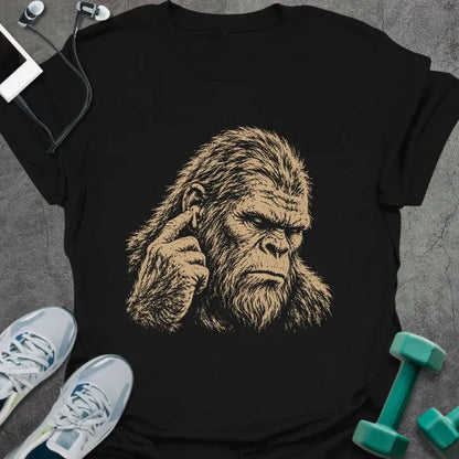 Black t-shirt with an illustration of Bigfoot's face with a concerned expression in white