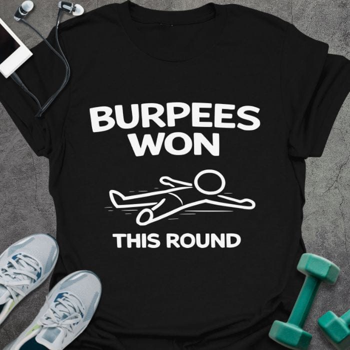 Black t-shirt printed with "Burpees Won This Round" in white, with an illustration of a stick figure on the ground