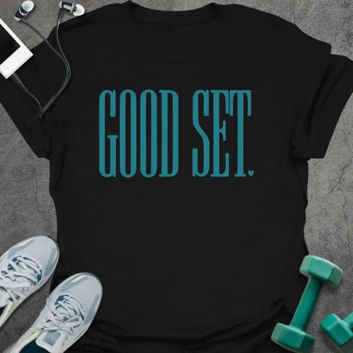 Black t-shirt printed with "Good Set." in teal