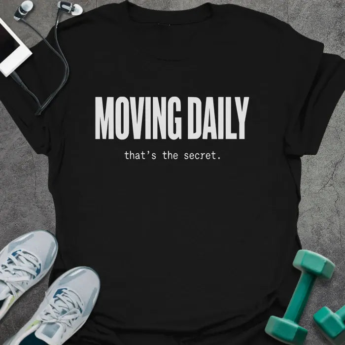 Black t-shirt printed with "MOVING DAILY that's the secret." in white