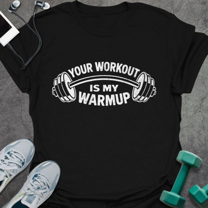 Black t-shirt printed with "Your Workout is my Warmup" in white, with a barbell icon