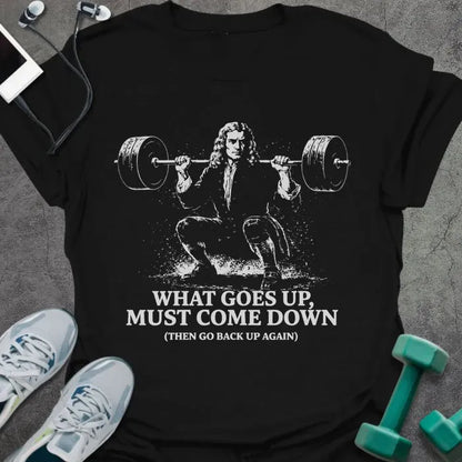 Black t-shirt printed with "What Goes Up, Must Come Down (then Go Back Up Again)", with a period-costume figure squatting a barbell