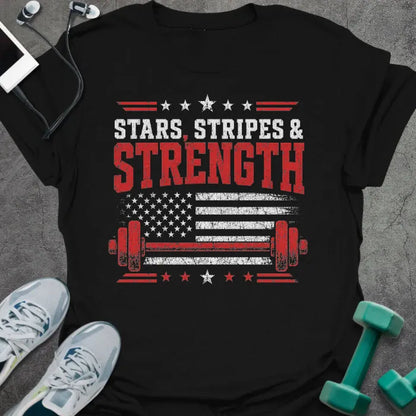 Black t-shirt printed with "Stars Stripes & Strength" in white, red, and blue, with a distressed flag and barbell graphics