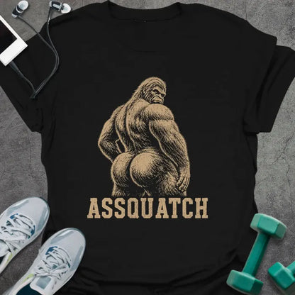 Black t-shirt printed with "Assquatch" in white, with an illustration of Bigfoot from behind