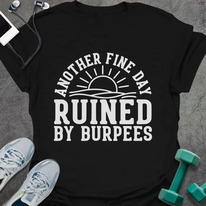 Black t-shirt printed with "Another Fine Day Ruined By Burpees", with an illustration of a sun
