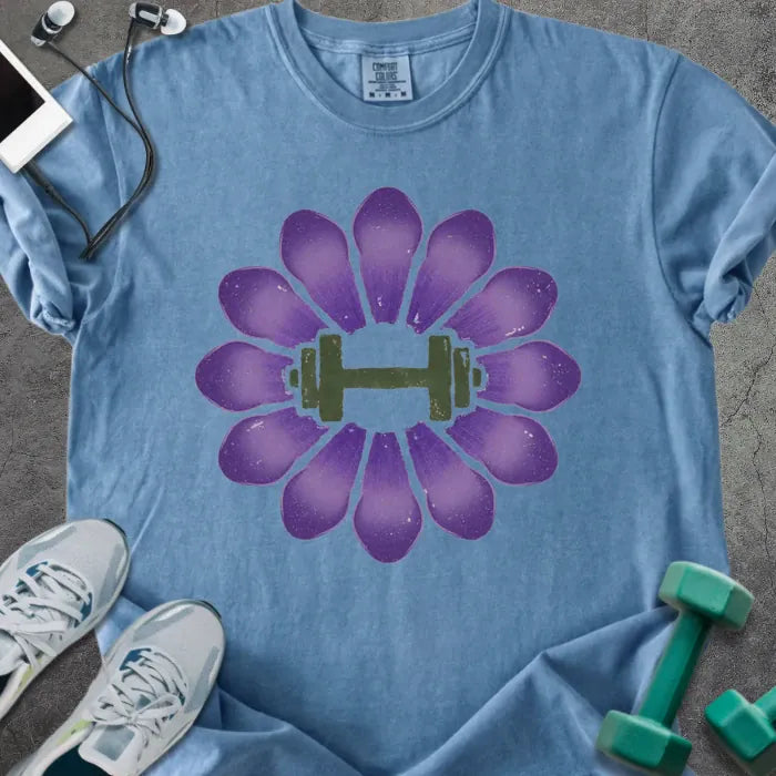 Blue jean t-shirt with purple crocus flowers and dumbbell in center in purple and green