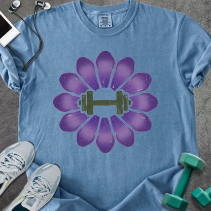 Blue jean t-shirt with purple crocus flowers and dumbbell in center in purple and green