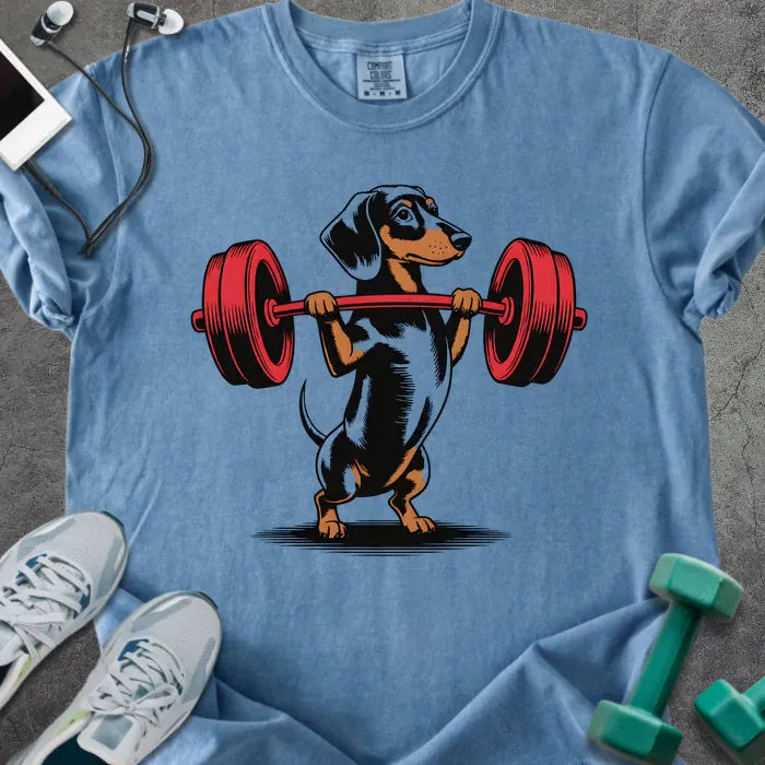 Blue jean t-shirt with a dachshund dog lifting a barbell in red
