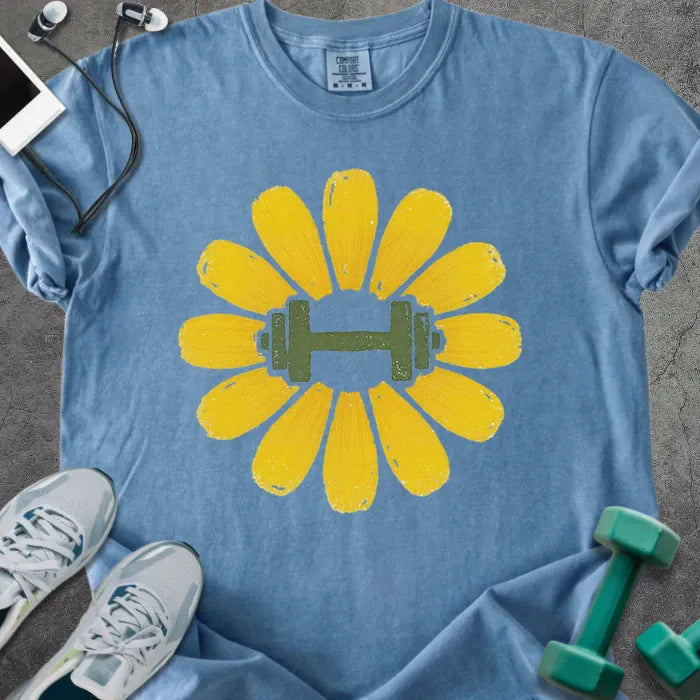 Blue jean t-shirt with yellow dandelion flower and dumbbell in center in yellow and green