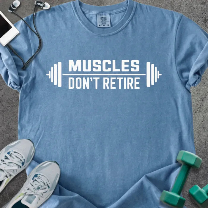 Blue jean t-shirt printed with "Muscles Don't Retire" in white, with a barbell