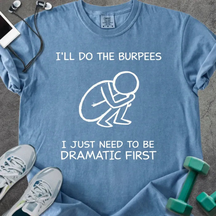 Blue jean t-shirt printed with "I'll Do the Burpees I Just Need to Be Dramatic First" in white, with a dramatic burpee stick figure graphic