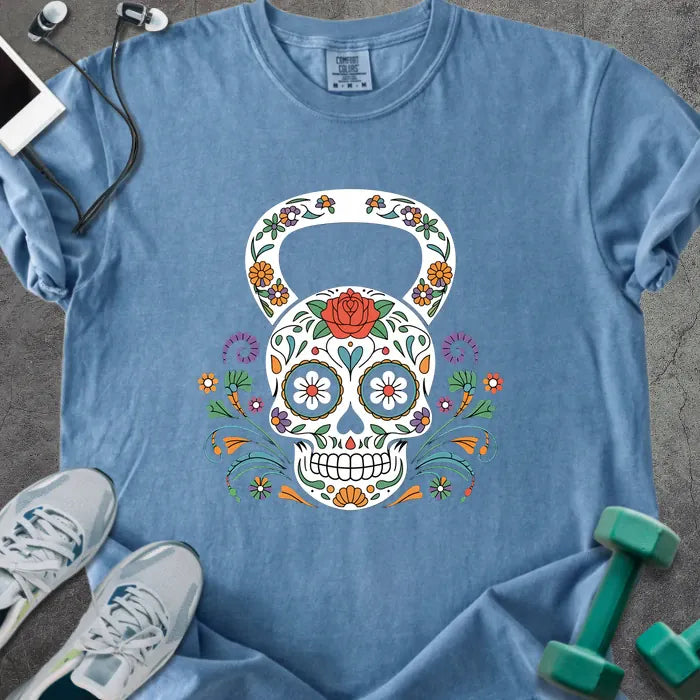 Blue jean t-shirt with a floral skull kettlebell graphic in multicolor