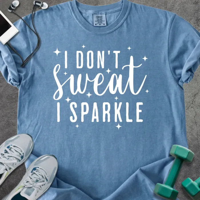 Blue jean t-shirt printed with "I Don't Sweat, I Sparkle" in white