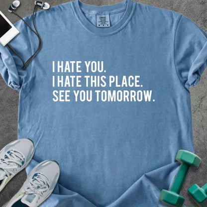 Blue jean t-shirt printed with "I Hate You. I Hate This Place. See You Tomorrow." in white
