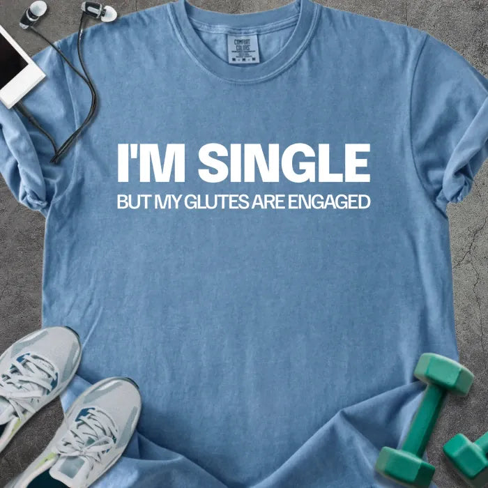 Blue jean t-shirt printed with "I'm Single but my Glutes Are Engaged" in white