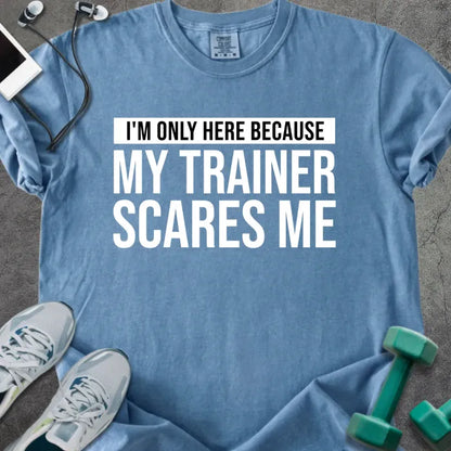 Blue jean t-shirt printed with "I'm Only Here Because my Trainer Scares Me" in white