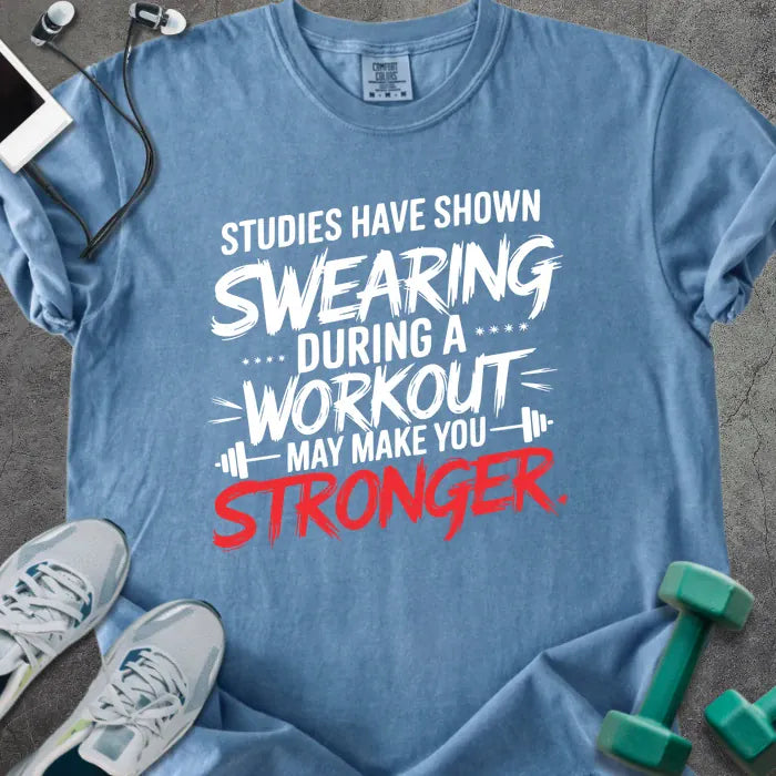 Blue jean t-shirt printed with "Studies Have Shown Swearing During a Workout May Make You Stronger" in red