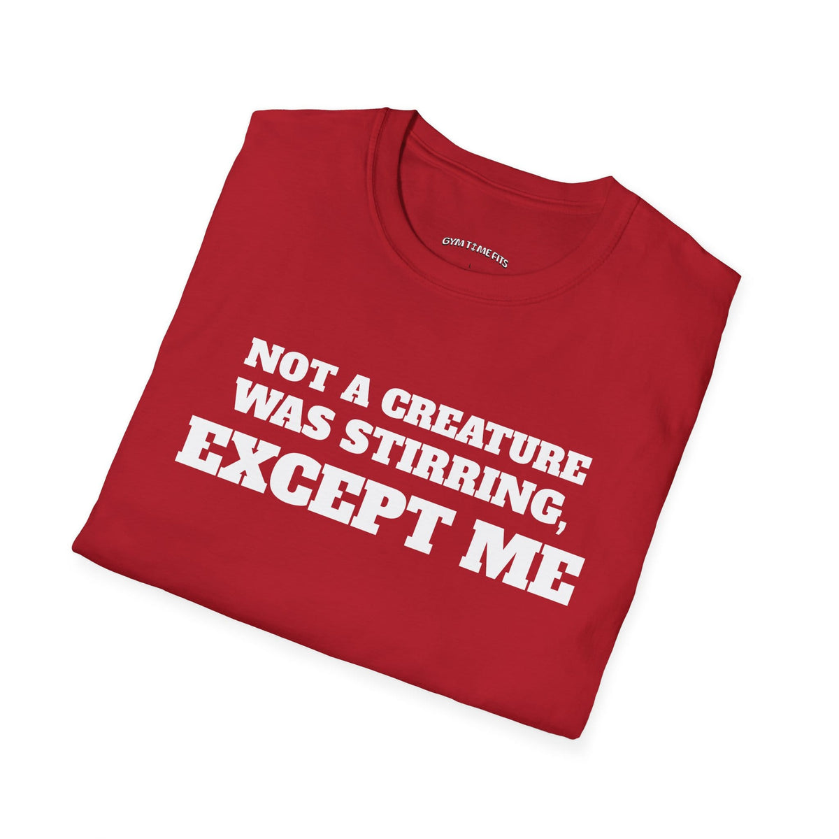Folded cherry red t-shirt printed with "NOT A CREATURE WAS STIRRING, EXCEPT ME" in white