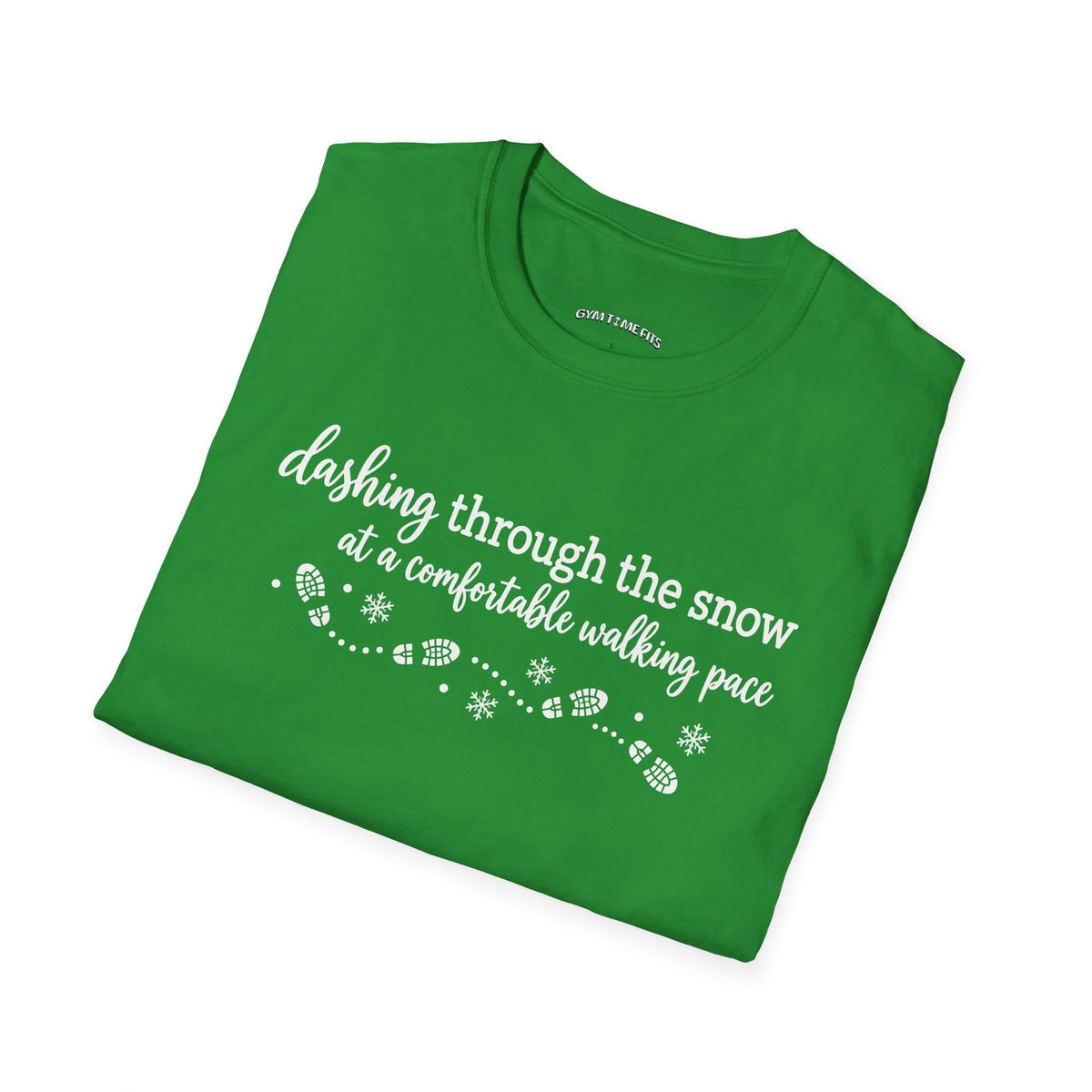 Folded Irish green t-shirt printed with "dashing through the snow at a comfortable walking pace" in white, with a dotted trail of footprints and snowflakes