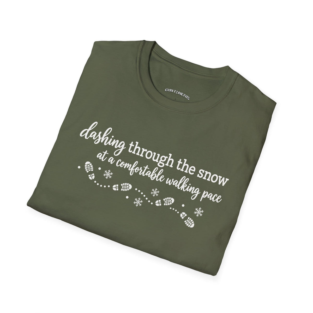 Folded military green t-shirt printed with "dashing through the snow at a comfortable walking pace" in white, with a dotted trail of footprints and snowflakes