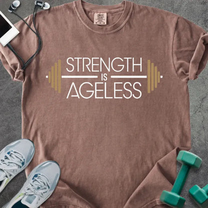 Espresso t-shirt printed with "Strength is Ageless" in white and gold, with a barbell graphic