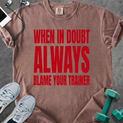 Espresso t-shirt printed with "When in Doubt Always Blame Your Trainer" in red