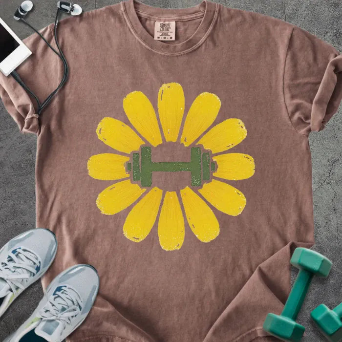 Espresso t-shirt with yellow dandelion flower and dumbbell in center in yellow and green