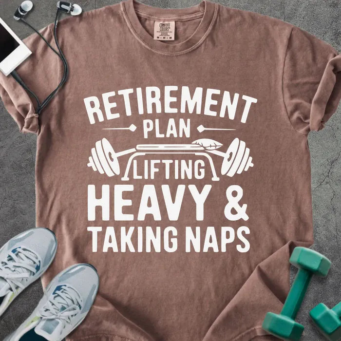 Espresso t-shirt printed with "Retirement Plan Lifting Heavy & Taking Naps" in white, with a barbell