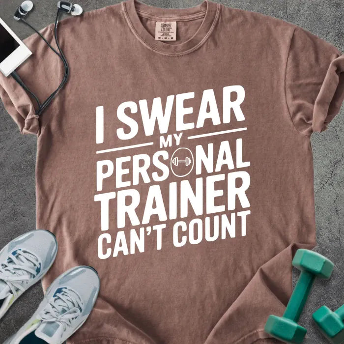 Espresso t-shirt printed with "I Swear my Personal Trainer Can't Count" in white