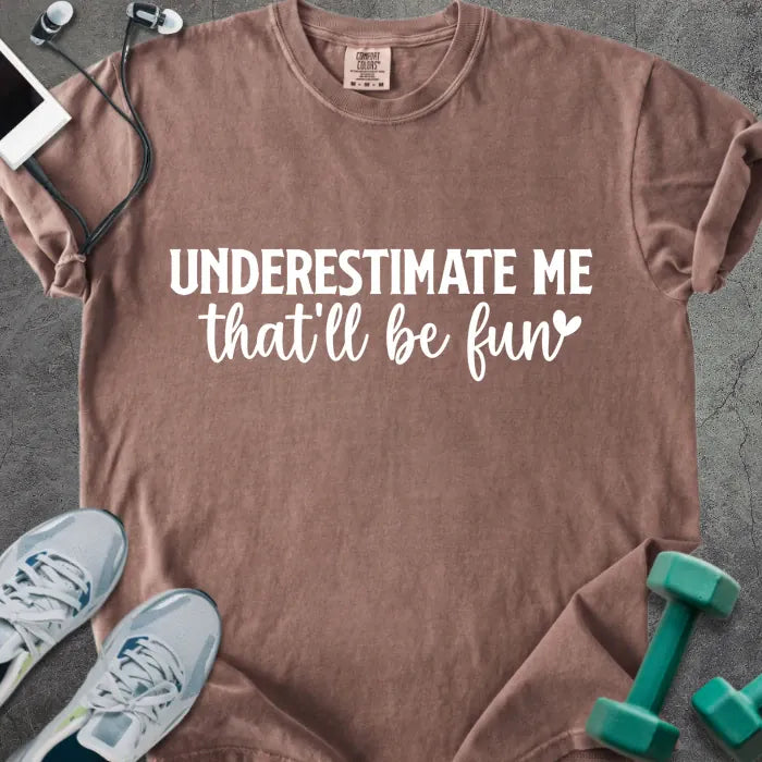 Espresso t-shirt printed with "UNDERESTIMATE ME that'll be fun" in white