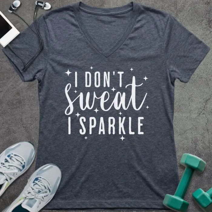 Heather navy t-shirt printed with "I Don't Sweat, I Sparkle" in white, with sparkle graphics
