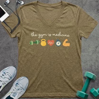 Heather olive t-shirt printed with "the gym is medicine" in yellow and orange, with dumbbell, kettlebell, heartbeat, weight scale, clock, and bicep graphics