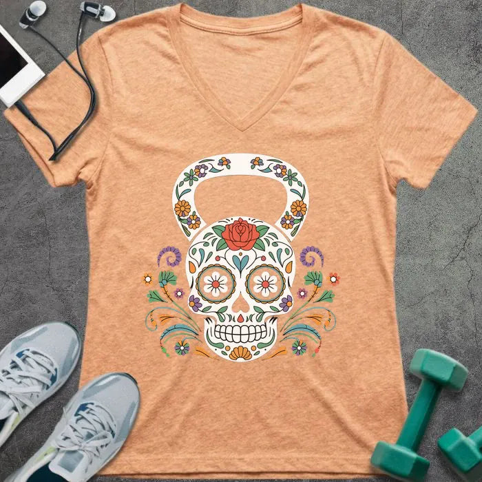 Heather peach t-shirt with a decorative skull kettlebell design in multicolor