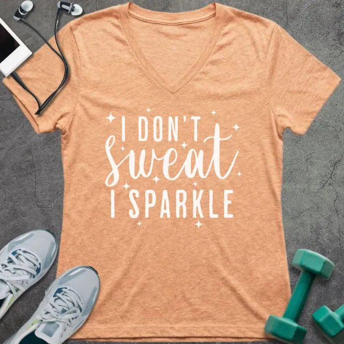 Heather peach t-shirt printed with "I Don't Sweat, I Sparkle" in white, with sparkle graphics