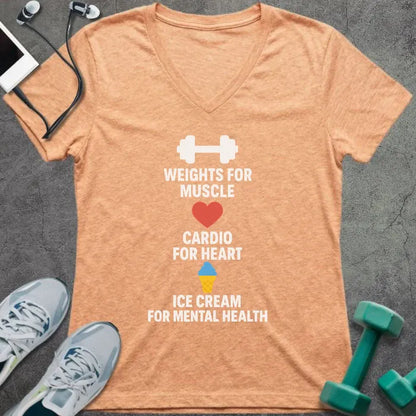 Heather peach t-shirt printed with "Weights for Muscle Cardio for Heart Ice Cream for Mental Health" in white, red, blue, yellow, with a dumbbell, heart, and ice cream cone icon between lines