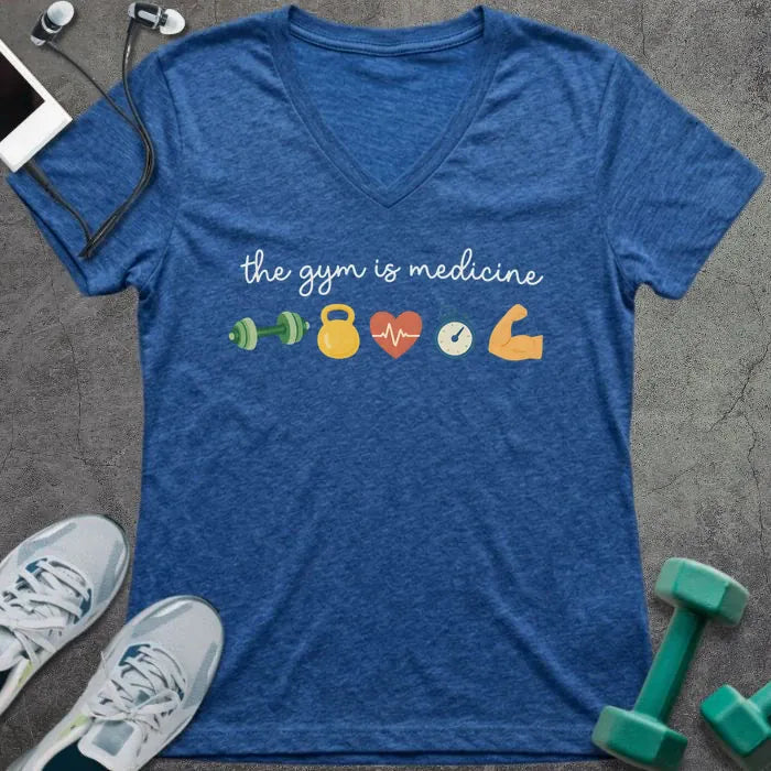 Heather true royal t-shirt printed with "the gym is medicine" in yellow and orange, with dumbbell, kettlebell, heartbeat, weight scale, clock, and bicep graphics