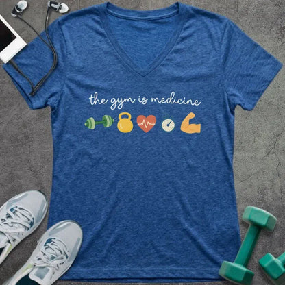 Heather true royal t-shirt printed with "the gym is medicine" in yellow and orange, with dumbbell, kettlebell, heartbeat, weight scale, clock, and bicep graphics