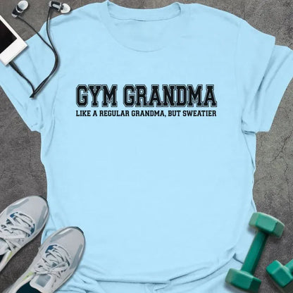 Light blue t-shirt printed with "GYM GRANDMA, LIKE A REGULAR GRANDMA, BUT SWEATIER" in black